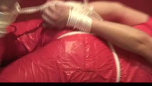 04:15 Min. video with Isabelle tied and gagged in a shiny nylon jumpsuit