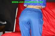 Sexy Sonja being tied and gagged overhead with ropes wearing a sexy blue shiny nylon pants and a jacket (Pics)