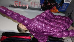 Watching SEXY SONJA wearing a sexy black shiny downskirt and a purple shiny nylon downjacket lolling on the bed (Pics)
