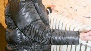 Jill tied and gagged on a heater wearing a shiny black down jacket and a darkblue rain pants (Pics)