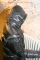 Jill tied and gagged on a heater wearing a shiny black down jacket and a darkblue rain pants (Pics)