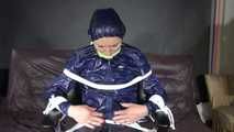 See Ronja tied and gagged on a Barber Chair in shiny nylon Rainwear and a shiny cape!