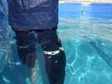 Watch Chloe cleaning the Pool in her shiny nylon Rainwear