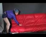 MARA wearing a specially made shiny nylon shorts and a rain jacket during preparing the sofa (Video)