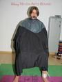 Katharina tied and gagged on a chair wearing shiny nylon rainwear and a raincape (Pics)