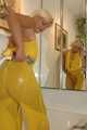 Busty Martina takes a hot bath in her yellow jumpsuit