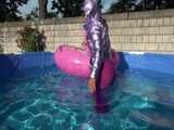 Watch Sandra enjoying her shiny nylon Downwear at a warm Summer Day in the Garden and in the Pool