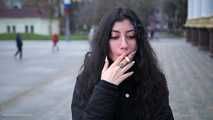 A big-eyed girl is smoking 100s cork Marlboro Red