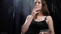 18 aged girl is smoking two 100mm Reds with a lot a nose exhales