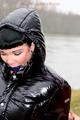 Beautiful archive girl tied and gagged outdoor by another one both wearing a shiny downjacket (Pics)