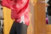 Mara wearing a red shiny nylon shorts, a black shiny leggins and a red rain jacket doing her workout (Pics)