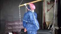 Watch Sandra bound gagged and wearing her shiny nylon Rainwear