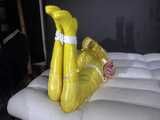 Watch Pia enjoying Bondage in her shiny nylon yellow Rainwear