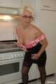 Blonde MILF Claudia strips in the kitchen