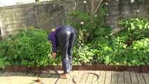 Watching sexy Sandra wearing a sexy blue rain pants and a purple rain jacket watering the flowers in the garden (Video)