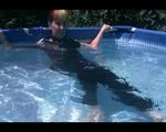 Mara sunbathing and swimming in the pool wearing a supersexy black adidas shiny nylon catsuit (Video)
