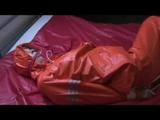 a 03:20 video with Pia tied and gagged in a shiny nylon rainsuit