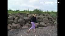 007001 Kim Takes Her First Pee Of The Day On The Rocky Beach