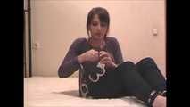 Satisfaction Girl - Barefoot brunette beauty uses cuffs and tape gag (video)