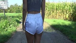 Watch Chloe taking a walk with her shiny nylon Shorts