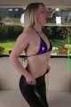 Sophie bound and gagged in a purple shiny wetlook Bikini