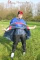 Jill wearing supersexy shiny nylon rainwear and a rain cape posing outdoor in the field (Pics)