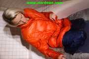 SEXY SONJA wearing a black shiny nylon rain pants and an orange big downjacket enjoying a bath (Pics)