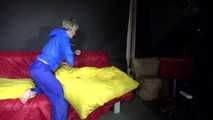 Sexy Sonja changing clothes wearing a sexy blue rainwear combination and preparing her sofa (Video)