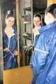 Lucy wearing sexy blue shiny nylon rainwear cleaning the mirror (Pics)