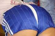 Sexy Pia being tied and gagged with ropes and a cloth gag on a stool wearing a sexy blue shiny nylon shorts and a tshirt (Pics)