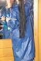 Lucy wearing sexy blue shiny nylon rainwear cleaning the mirror (Pics)