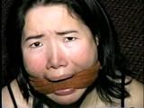 25 YEAR OLD ASIAN MAI-LING IS BALL-TIED, MOUTH STUFFED, BAREFOOT, TOE-TIED, FOOT TICKLED, WRAP ACE BANDAGE GAGGED & CLEAVE GAGGED (D56-1)
