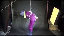 MARA tied and gagged overhead with ropes and a cloth gag wearing a super sexy super shiny purple rainsuit and blue rubber boots (Video)