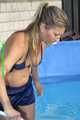 Watch Sandra cleaning the pool wearing a shiny nylon Shorts