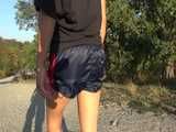 Watch Sandra having a Trip with her Car and doing a Walk in her shiny nylon Shorts