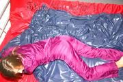 Alina preparing her bed for relaxing and lolling on the bed wearing a sexy shiny nylon rain pants and a rain jacket (Pics)