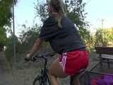 Get a Video with Sandra riding her bike enjoying her shiny nylon Shorts