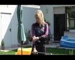 Pia wearing a sexy black/pink adidas sweat suit while watering the flowers in the garden (Video)