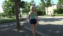 Watching SEXY SONJA walking through the city wearimg a blue shiny nylon shorts and tshirt (Video)