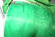Sonja oiling and rinsing herself in the shower wearing a supersexy green shiny nylon shorts and rain jacket (Pics)