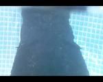 Mara sunbathing and swimming in the pool wearing a supersexy black adidas shiny nylon catsuit (Video)