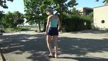 Watching SEXY SONJA walking through the city wearimg a blue shiny nylon shorts and tshirt (Video)