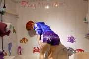 Sonja taking a shower wearing a very hot purple shiny nylon shorts and a blue rain jacket (Pics)