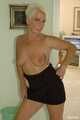 Blonde mature Claudia stipping out of a black dress