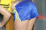 ***NEW MODEL*** Sandra wearing highheels and a sexy blue/yellow shiny nylon shorts and a yellow top during cleaning the mirror (Pics)