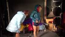 Watching sexy Stella and Sandra wearing a sexy shiny nylon shorts putting on several chiny nylon down jackets (Video)