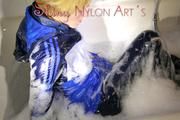 Sonja wearing a super sexy shiny nylon rain jacket and rain pants while taking a foam bath (Pics)