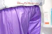 Mara tied, gagged and hooded in a shower wearing a sexy purple/silver sweat suit (Pics)
