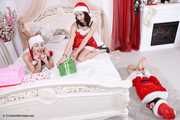 Lucky, Nelly, Xenia - Santa’s little helpers tie each other up on a bed