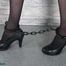 Glamour girl chained and cuffed